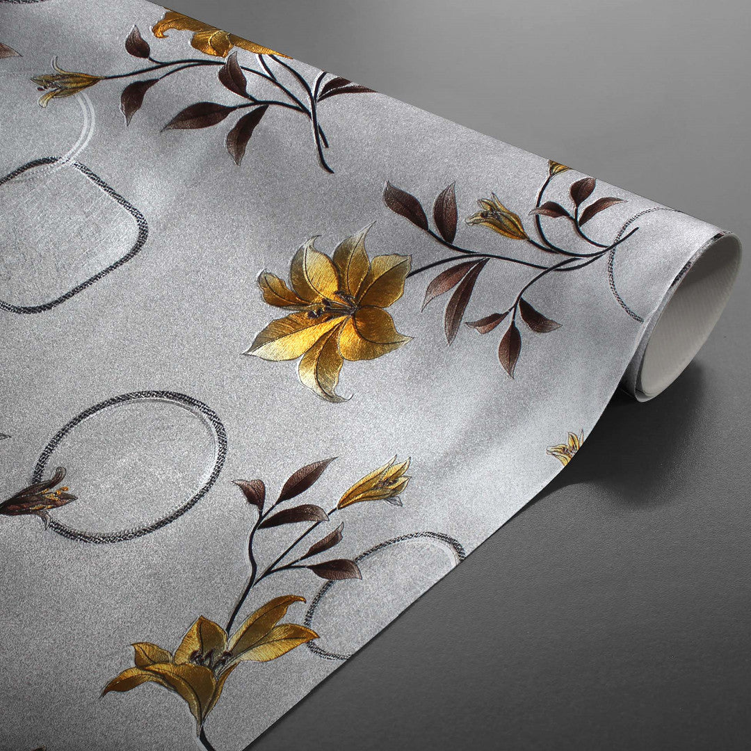Aufgerollte Altea Metallic Yellow Wachstuch Tischdecke in Silber mit goldenen Blumen