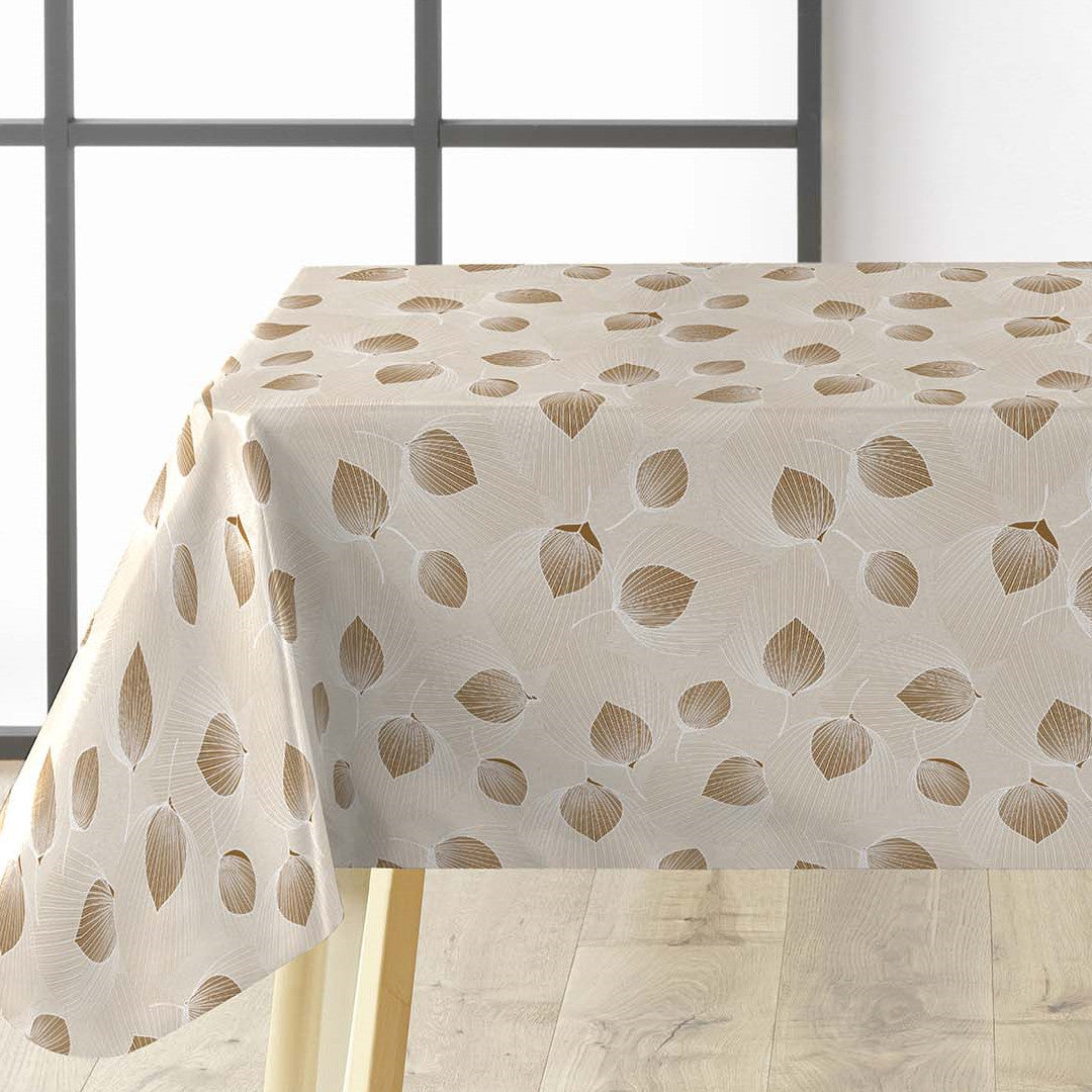 Helga Creme Wachstuch Tischdecke auf Tisch mit eleganten Blättern und cremefarbenem Grund