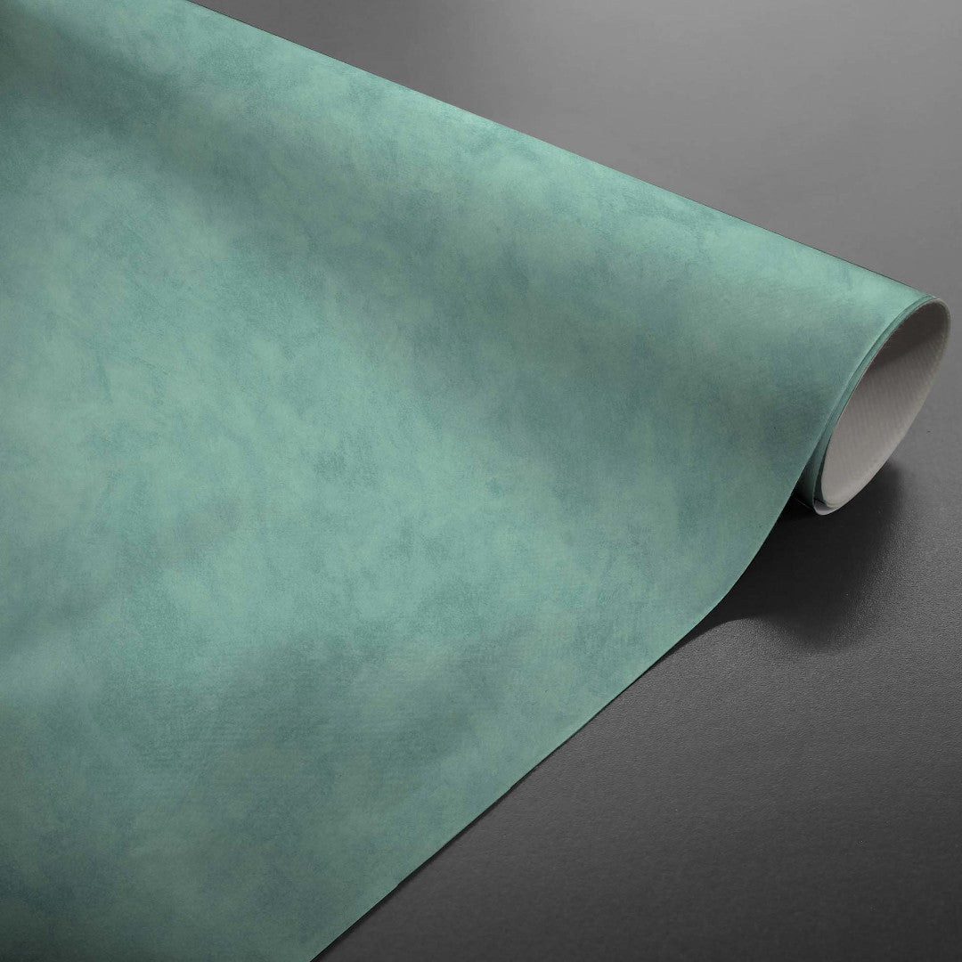 Beton Cire Ocean – glatte Wachstuch Tischdecke in grün-blauer Nuance, aufgerollt