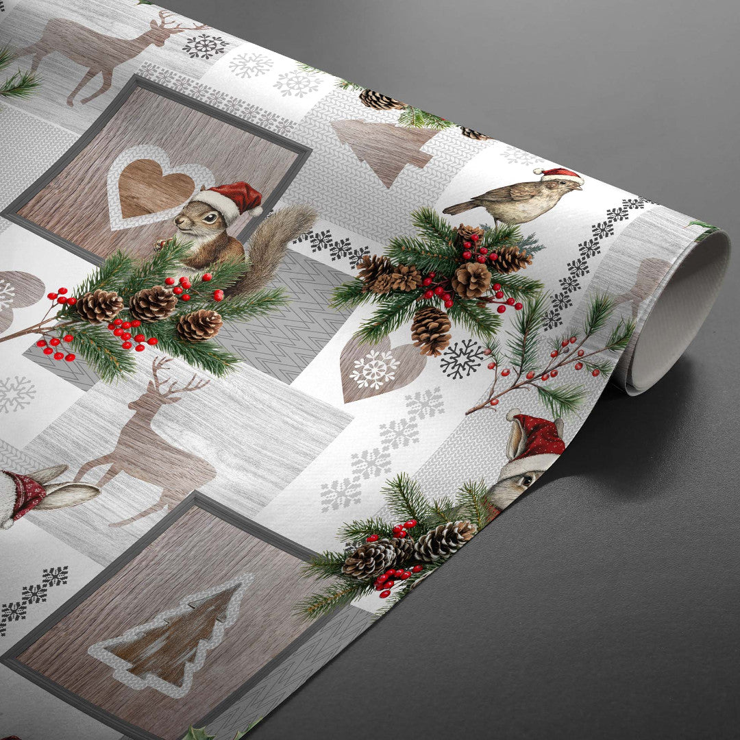 Ansel – Wachstuch Tischdecke für Weihnachten mit Rentier und Kaninchen in Winterlandschaft, aufgerollt
