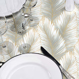 Betty Golden Palm – elegante Wachstuch Tischdecke mit goldenen Palmblättern, Nahaufnahme