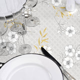 Hortense - Wachstuch Tischdecke mit floralem Muster in goldenen und neutralen Tönen, Nahaufnahme