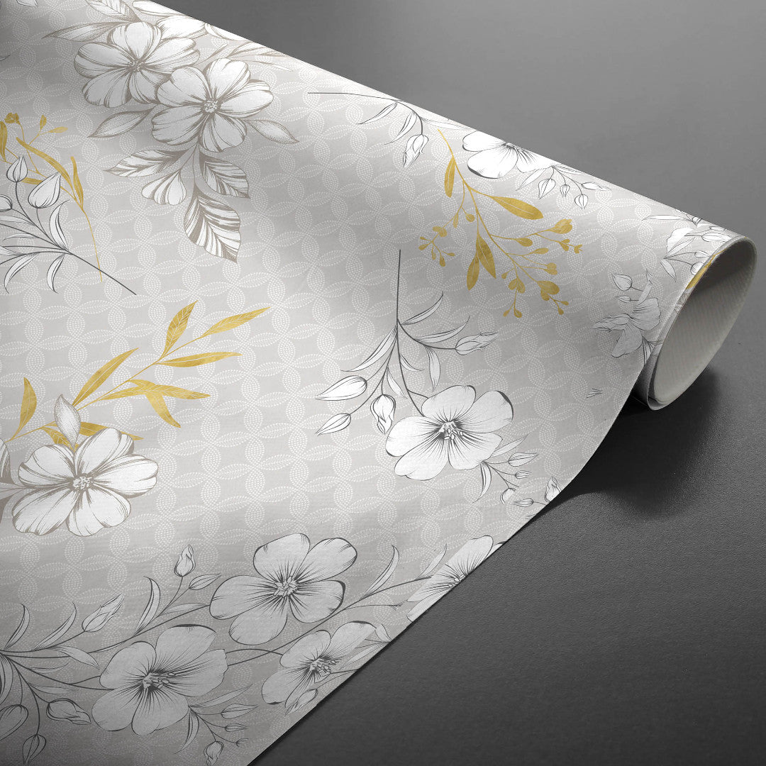 Hortense - Wachstuch Tischdecke mit floralem Muster in goldenen und neutralen Tönen, aufgerollt