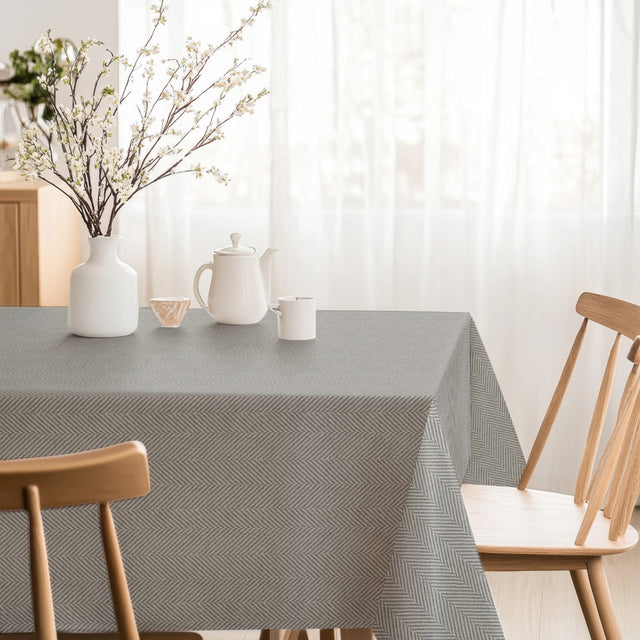 Nagore Gris – Abwaschbare Tischdecke mit klassischem Fischgrätmuster, Ecke