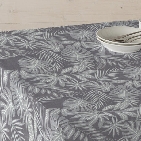 Casiopea Grau – abwaschbare Tischdecke mit tropischen Blättern