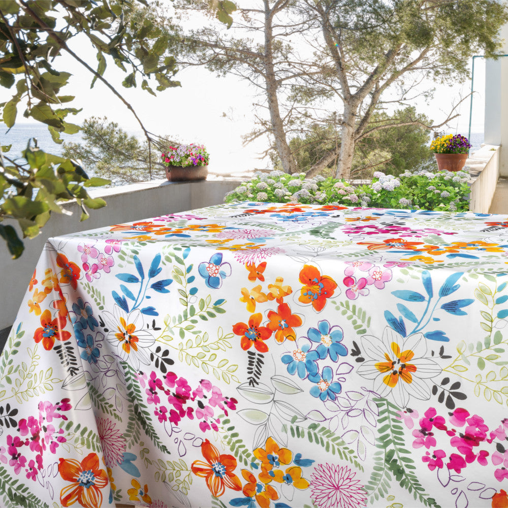 Dufthaven - Weiße Wachstuch Tischdecke mit farbenfrohen Blumen, auf dem Tisch