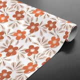 Flory Orange – Schöne Wachstuch Tischdecke mit Blumen in warmen Nuancen, aufgerollt