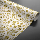 Gerollte Guldflor Wachstuch Tischdecke mit Goldblumen auf weißem Hintergrund