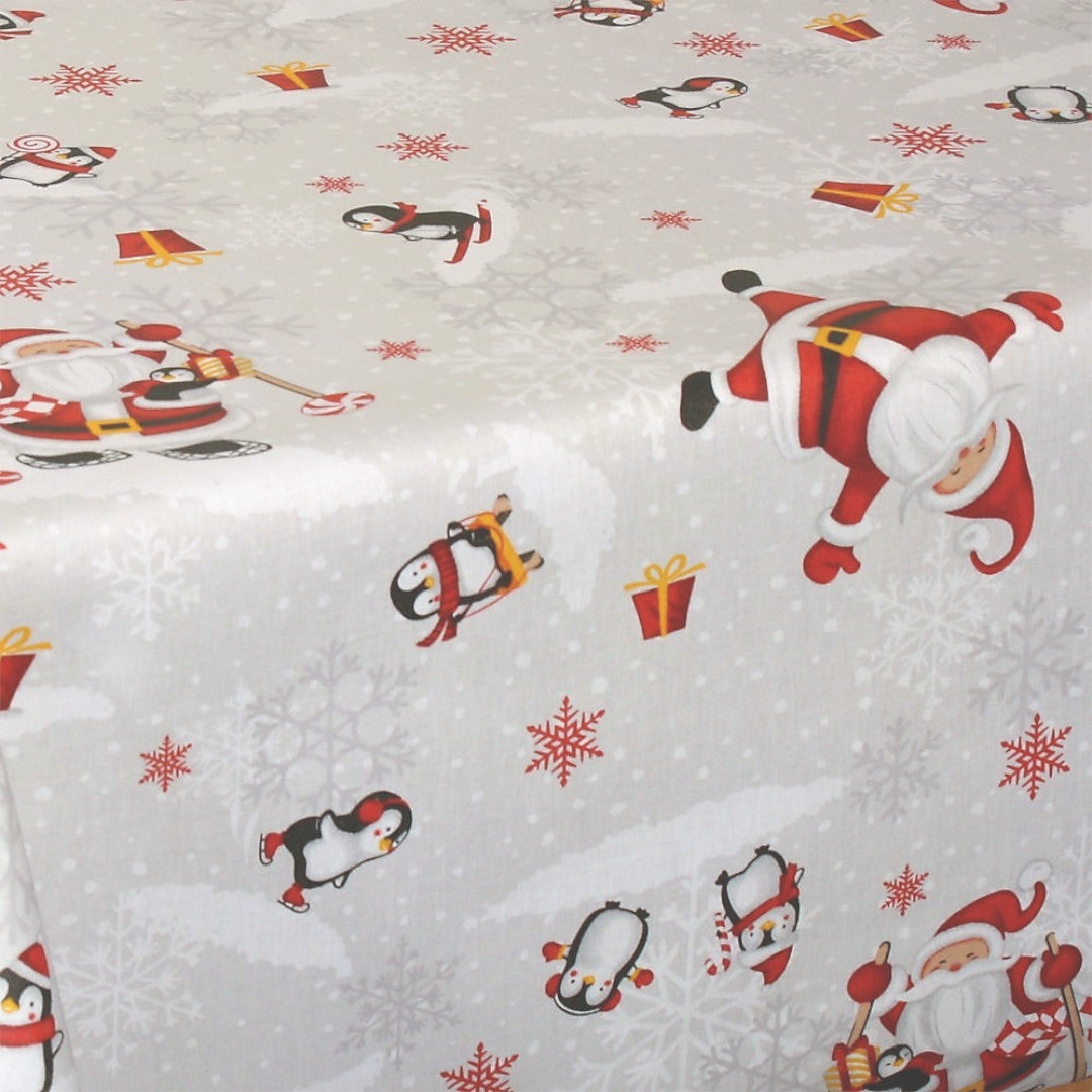 Weitere Nahaufnahme der Weihnachtstischdecke Weihnachtsfest am Südpol mit Pinguinen und Schneeflocken