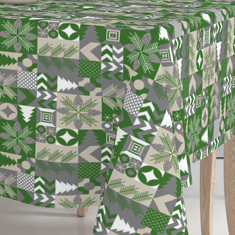 Nahaufnahme der Ecke der Merry Present Green Wachstuch Tischdecke für Weihnachten mit grafischem Waldthema